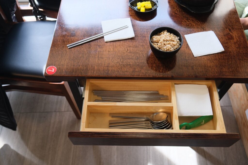 chopsticks and cutlery can be found in the table drawer in Korea